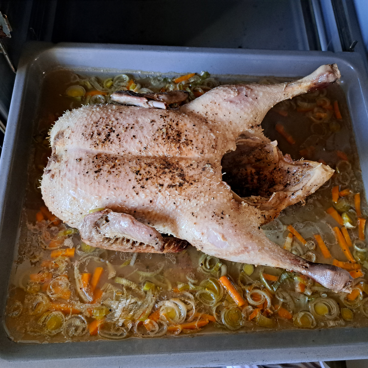 German whole duck after the first hour of roasting.