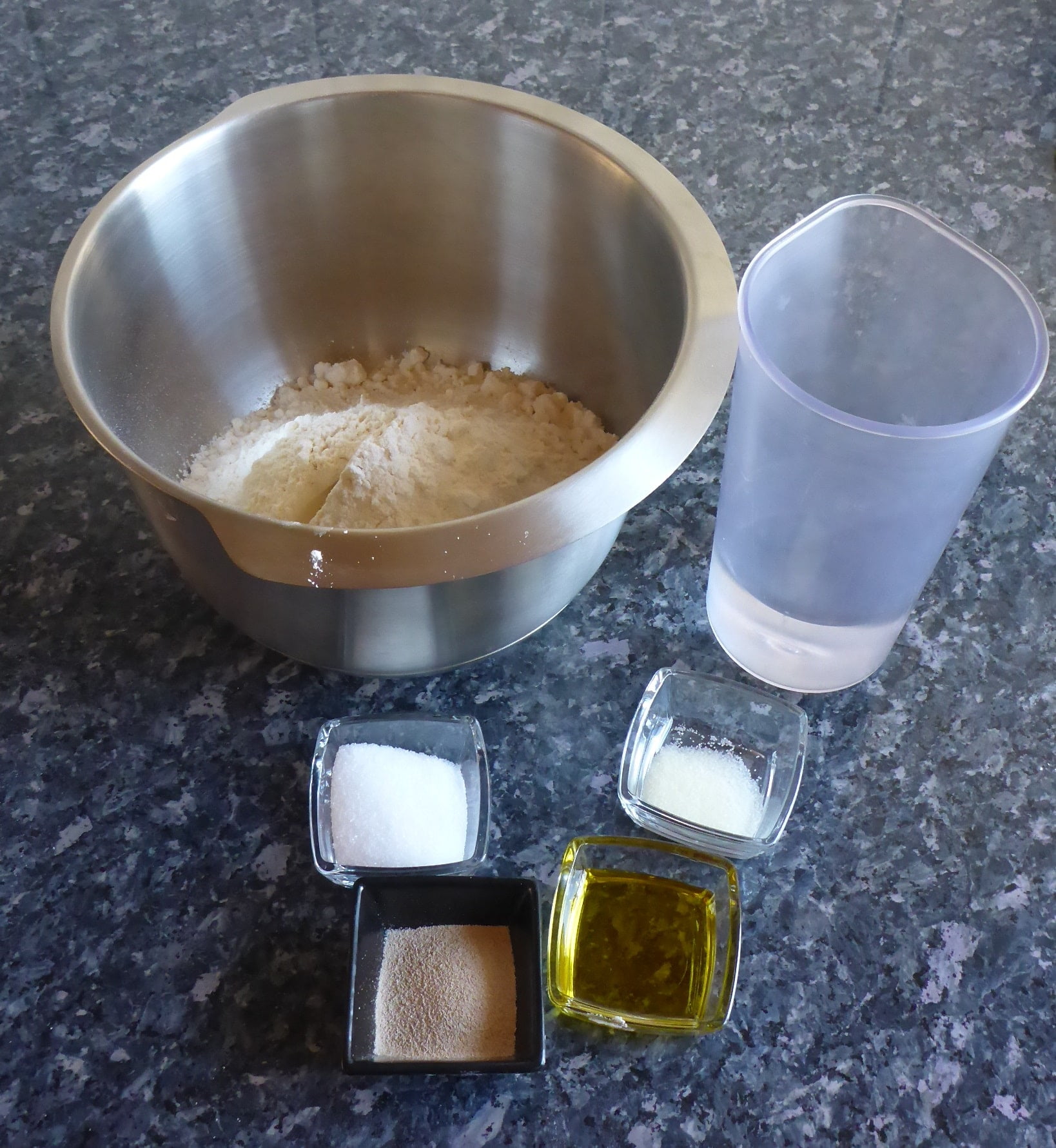 Ingredients for Yeast Dough: Flour, Yeast, Water, Sugar, Salt, and and olive oil.