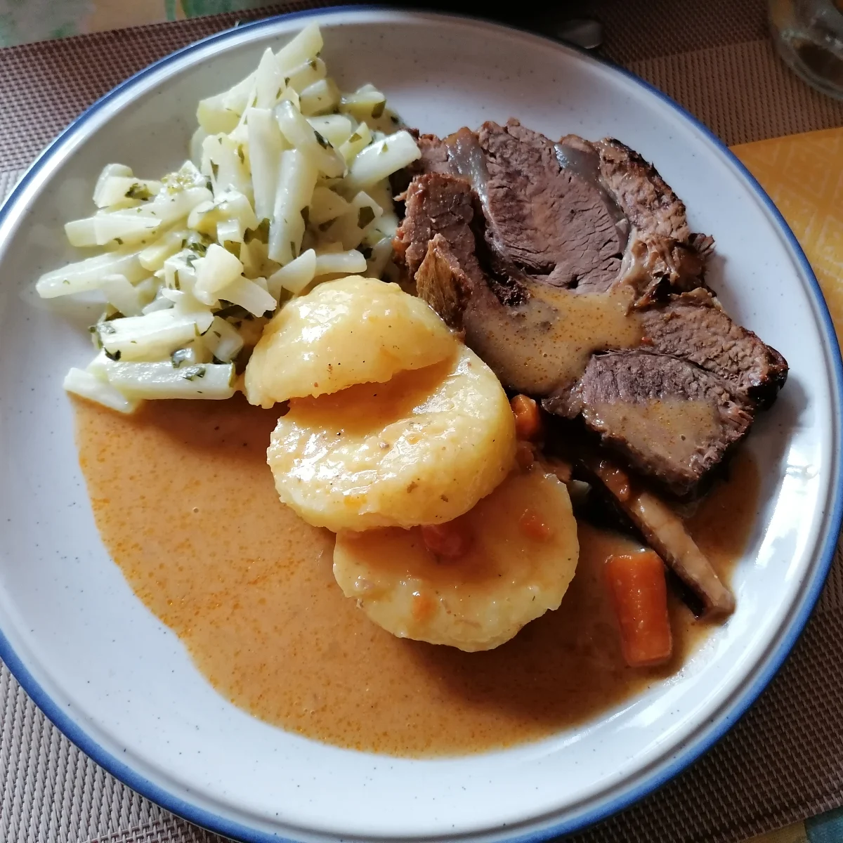 German roast beef served wih potato dumplings and Creamed kohlrabi