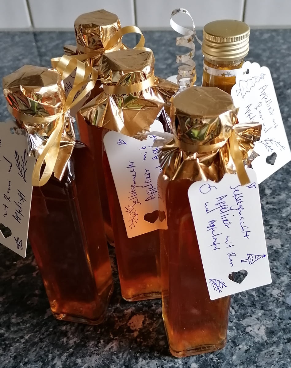 Liqueur filled in Beautifully decorated glass bottles, ready to give as gifts from the kitchen.