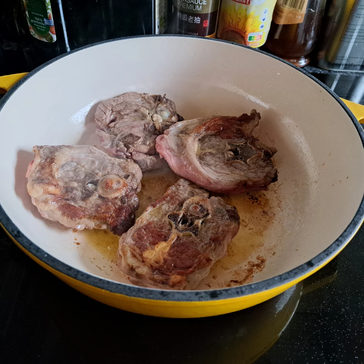 Image capturing lamb neck chops being perfectly browned all over, a crucial step in the process of preparing delicious lamb stew.