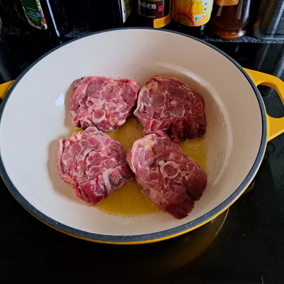 Image capturing lamb neck chops being perfectly browned all over, a crucial step in the process of preparing delicious lamb potjiekos.