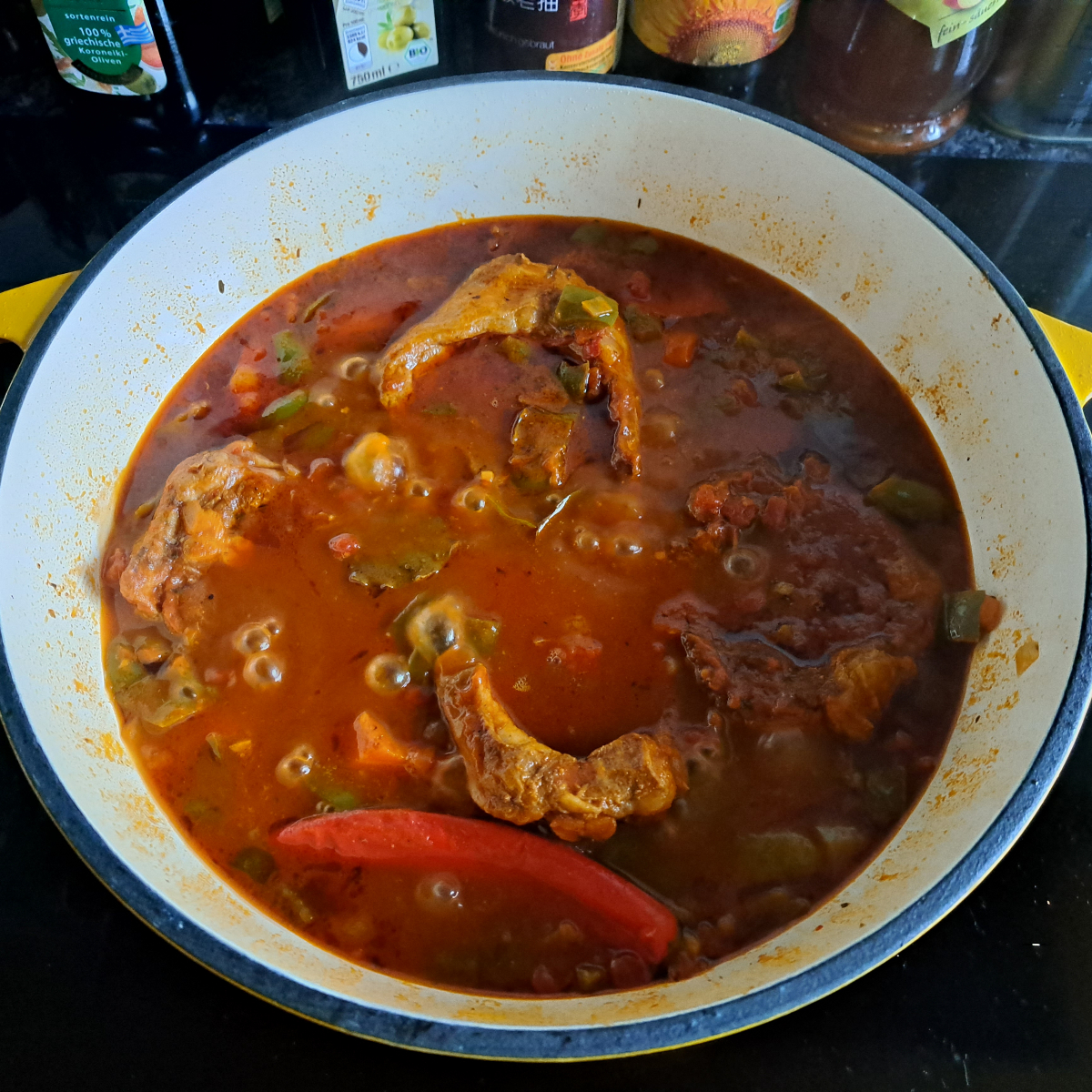 Image capturing lamb stew after 90 minutes of cooking, with the cover being lifted to reduce the sauce, revealing a tantalizing, simmered dish.